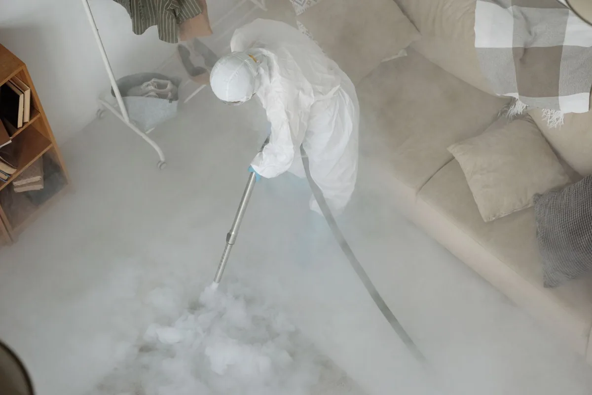 Biohazard cleanup technician in protective equipment, Belleville, MI